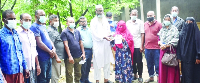 Chairman of Nashipur Union under Gabtoli upazila of Bogura Nazrul Islam Mintu Shakider on Wednesday distributes tk. 500 cash among 250 jobless people of the Union to survive the ongoing lockdown imposed nationwide by the government to contain deadly coron