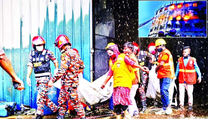 Firefighters and rescue workers recover the bodies of the workers who died in the Narayanganj's Rupganj factory fire. The burning factory of Hashem Foods Ltd is seen in the inset.