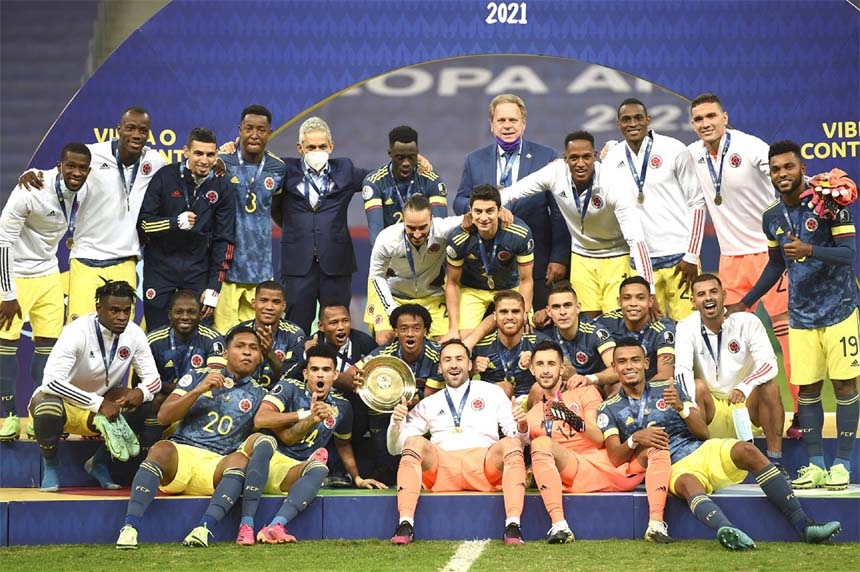 Members of Colombia team pose on the podium with their medals and trophy after defeating Peru 3-2 in 2021 Copa America third-place match at the Mane Garrincha Stadium on Friday.