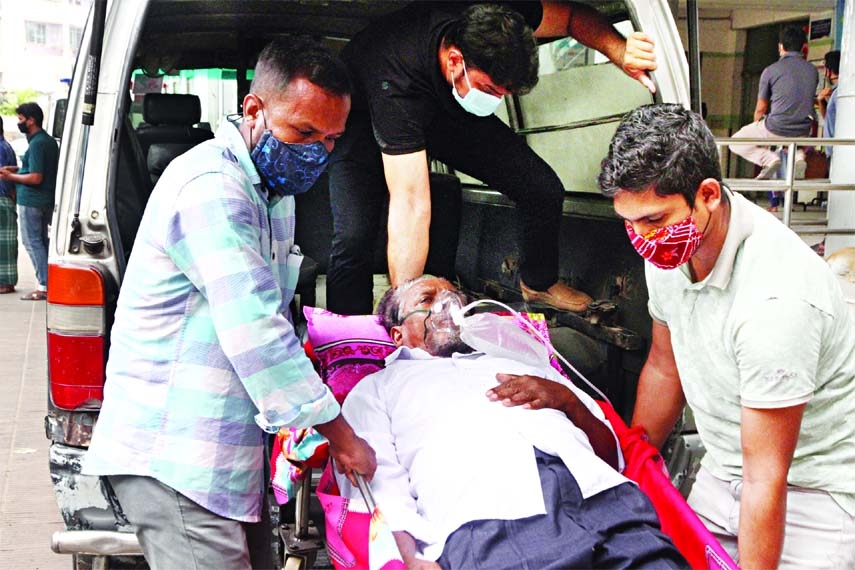 A patient having respiratory problem being taken to Dhaka Medical College Hospital from an ambulance on Saturday as Covid surge arose across the country.