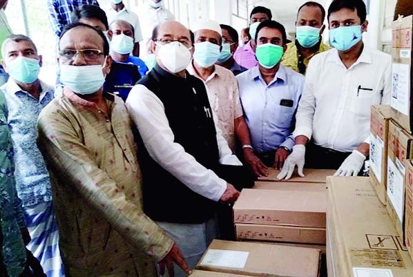 Adv. Amirul Alam Milon, MP hands over emergency medical equipments including 15 oxygen cylinders to Dr. Kamal Hoshen Mufti, Morelganj Upazila Health and Family Planning Officer at a formal ceremony held at the health complex on Saturday.