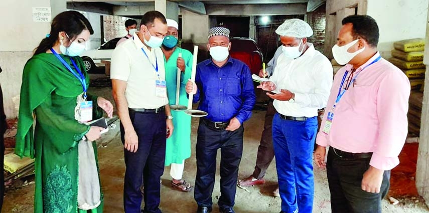 A mobile court of Mymensingh City Corporation headed by Executive Magistrate Shakil Ahmed fines a building owner Tk 10,000 for finding Aedes mosquito larvae in his under construction building at the city's Natunbazar area on Monday. Dr HK Debnath, Chief