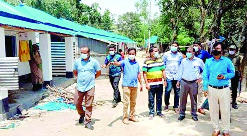 Badrul Alam, Assistant Project Director, Asrayan Project, PMO on Sunday visits homes built for the landless and homeless people as gifts from the Prime Minister on the occasion of Mujib Year at Mohadevpur Sadar, Naogaon.