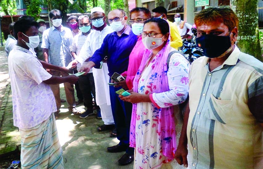Chairman of Tarash Upazila Parishad Moniruzzaman Moni distributes Tk. 500 cash aid each among 200 extremely poor and destitute families of the upazila in a formal ceremony held under the chairmanship of Upazila Nirbahi Officer on Monday.