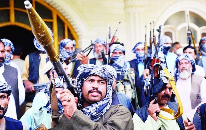 Afghan militia gather with their weapons to support Afghanistan security forces against the Taliban, in Afghan warlord and former Mujahideen leader Ismail Khan's house in Heart.