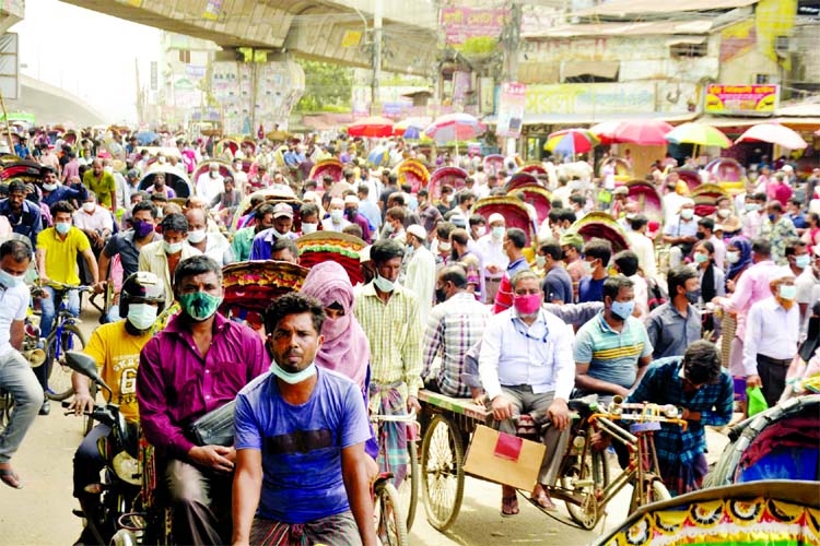 Hundreds of rickshaw-pullers are seen carrying passengers at Jatrabari area in the capital on Wednesday on the last day of strict lockdown.