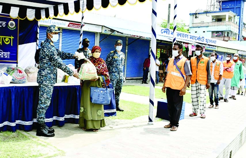 Bangladesh Navy under the supervision of Commander Khulna Naval Area distributes food aid among the members of National Blind and Sight-disabled Organisation in the remote areas of Khulna City and Digholia Upazila on Thursday.