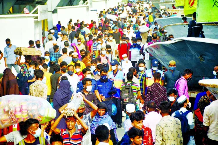 People rush to Sadarghat launch terminal on Thursday to go to their village homes ahead of Eid-ul-Azha defying Covid-19 health rules.