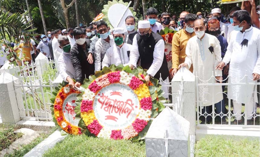 State Minister for Information and Broadcasting Dr. Murad Hasan pays floral tributes on the grave of former President of Jamalpur Zila Awami League and organizer of the Liberation War Advocate Matiar Rahman Talukder at Sarishabari in Jamalpur on Friday ma