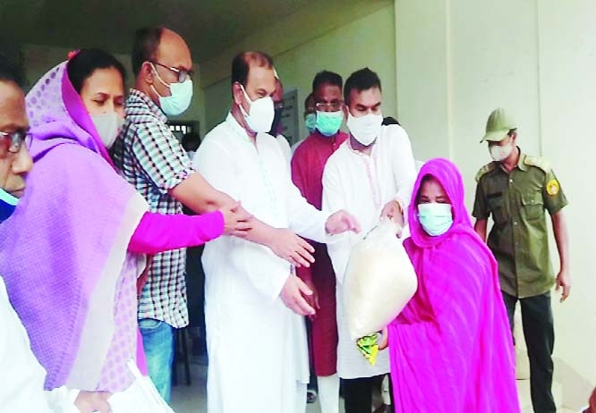 Local MP of Tarash Upazila under Sirajganj district distributing VGF rice among destitute people on Friday.