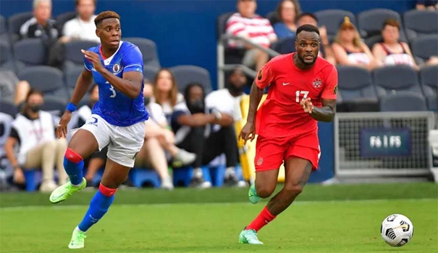 Canadian forward Cyle Larin (right) advances with the ball against Haiti at the CONCACAF Gold Cup on Thursday.