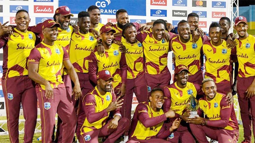 West Indies players pose with the trophy after winning the five-match T20I series against Australia on Friday.