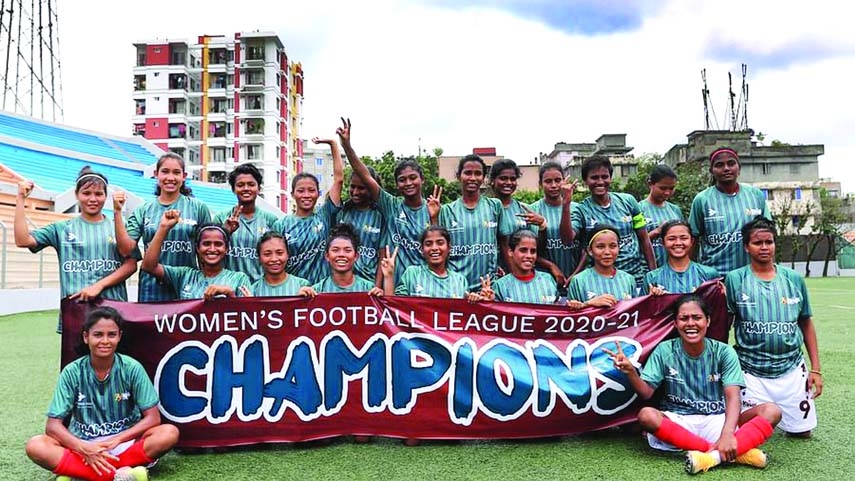 Bashundhara Kings players celebrate after winning the Women's Football League on Saturday at Birshreshtha Shaheed Sepoy Mohammad Mostafa Kamal Stadium in the city's Kamalapur.