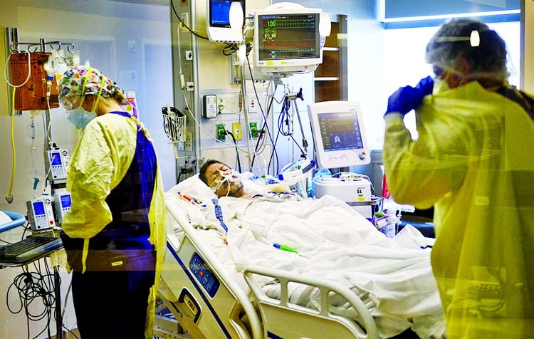 An intubated patient lies on a bed after being turned from laying on their stomach in the Covid-19 ICU) at Renown Regional Medical Centre in Nevada, US.