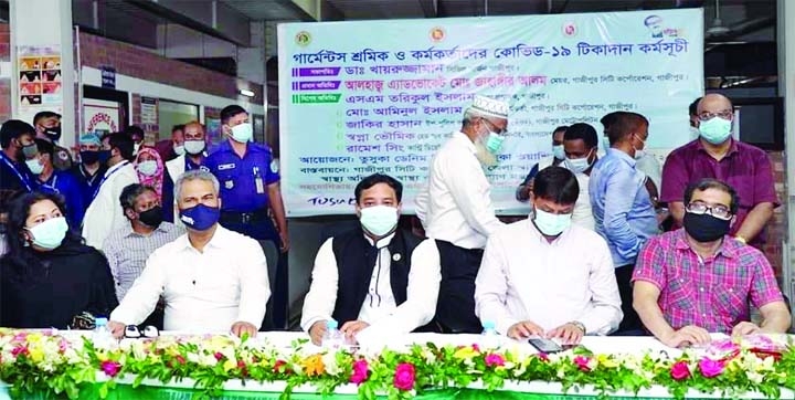 Mayor of the Gazipur City Corporation Adv. Mohammad Jahangir Alam as chief guest attends the inauguration ceremony of Covid-19 vaccination program for the city's garments officials and workers held at Konabari on Sunday with Dr. Khairuzzaman, Gazipur Civ