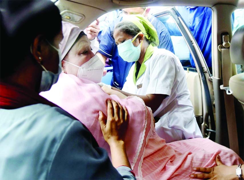 BNP Chairperson Begum Khaleda Zia receives first dose of Covid-19 vaccine sitting inside her car at Sheikh Russel Gastro Liver Institute and Hospital in the city on Monday.