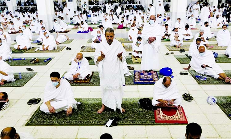 Pilgrims practise social distancing as they pray at the Namira Mosque in Arafat during Hajj, near the holy city of Makkah, Saudi Arabia on Monday.