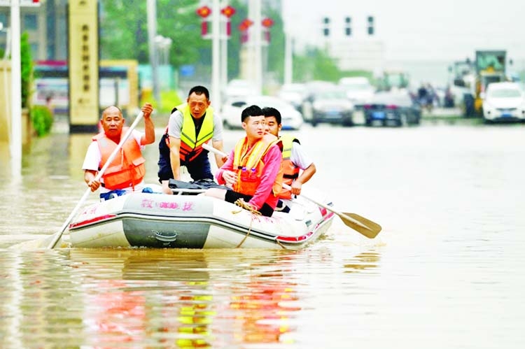 Rescue workers in an inflatable dinghy following devastating floods in Zhengzhou that killed at least 33 people.