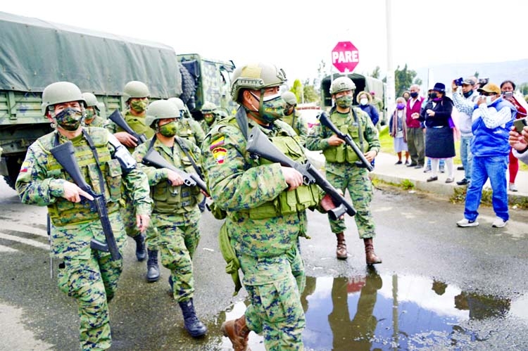 Soldiers guard the entrance to the Sierra Centro Norte prison in Special Police units deployed to the jails in southern Guayas province and Cotopaxi province, south of Quito, the capitol, to quell the violence, the government said.