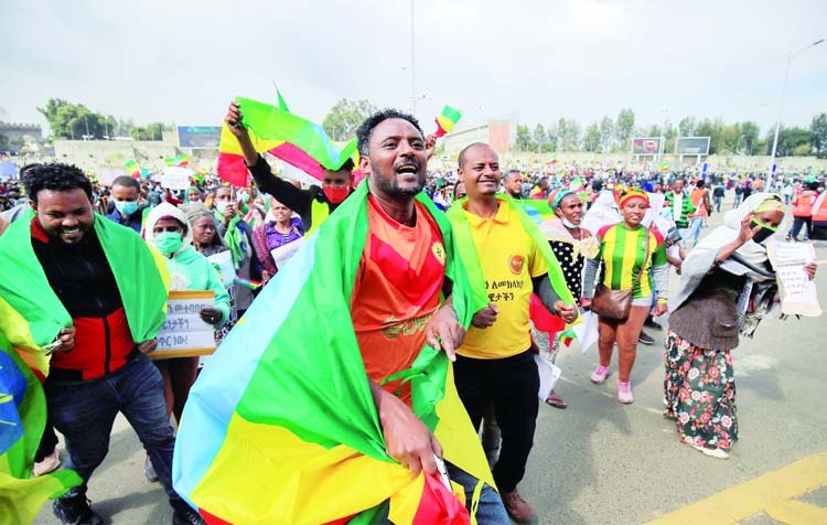 Men dance during the pro-government rally to celebrate the second filling of the Great Renaissance Dam (GERD) being built on the Nile River and to condemn Tigray People Liberation Front (TPLF) at the Meskel Square in Addis Ababa, Ethiopia.