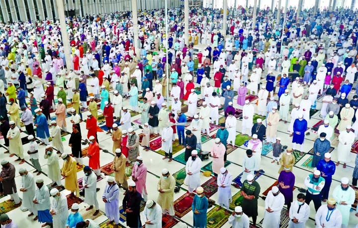 Muslim devotees offered Eid-ul-Azha prayer at the National Mosque Baitul Mokarram in the capital on Wednesday by following health rules.