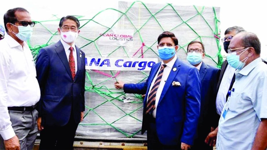 Foreign Minister Dr. AK Abdul Momen receives the first consignment of 2,45,200 doses of AstraZeneca vaccine from Japan at Hazrat Shahjalal International Airport in the city on Saturday. Officials of the Japanese Embassy in Dhaka were present on the occasi