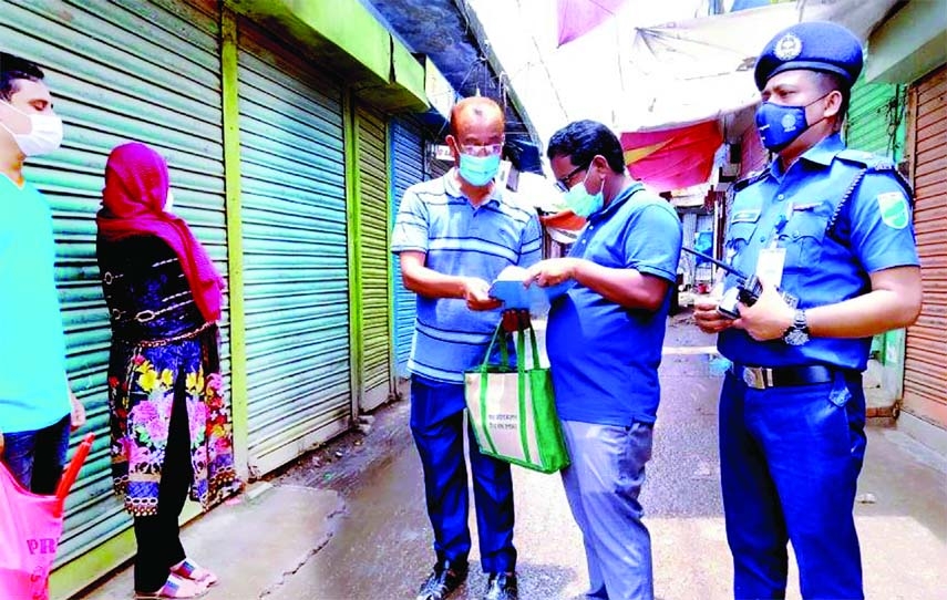 Damudya UNO Md. Sadekur Rahman Sabuj fines some people and business outlets of Damudya Bandar area Tk 10,800 for defying health guidelines on the second day of the ongoing 14-day nationwide lockdown on Saturday. Damudya Thana officer-in-charge Sharif Aham