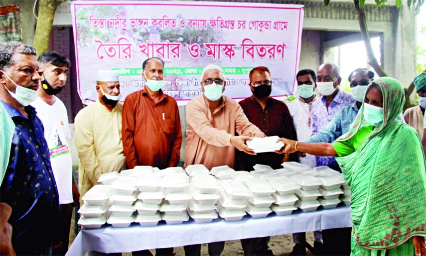 Gallant freedom fighter guerrilla leader Dr SM Shafiqul Islam Kanu on Saturday inaugurates a food and masks distribution program among 300 families affected by the flood and erosion of the river Teesta at Char Gokunda area of Sadar Lalmonirhat upazila Bha