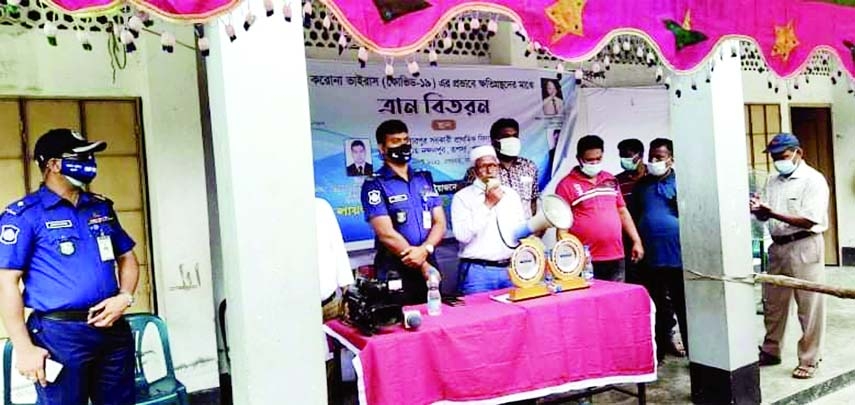 Lion Kazi Akramuddin Ahmed, Director of Lions Club of Dhaka Capital Garden International speaks in a foodstuff distributing meeting at West Nandanpur in Rupsha upazila of Khulna district recently while Police Superintendent of Khulna Mohammad Mahbub Has