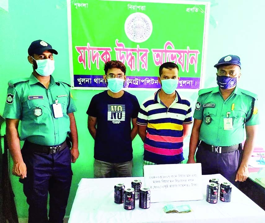 Members of Khulna Kotwali police station arrest two drug peddlers with 7 Cans of Beer from in front of a Hair Dresser in the city's KD Ghosh road area on Sunday.