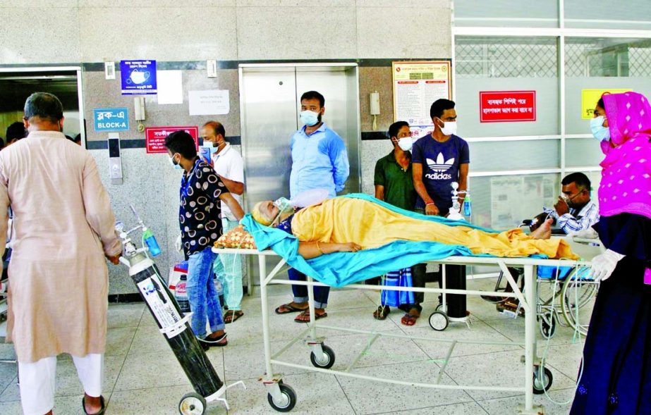 A Covid-19 patient being brought to DNCC Covid Hospital in Dhaka on Sunday with oxygen support.