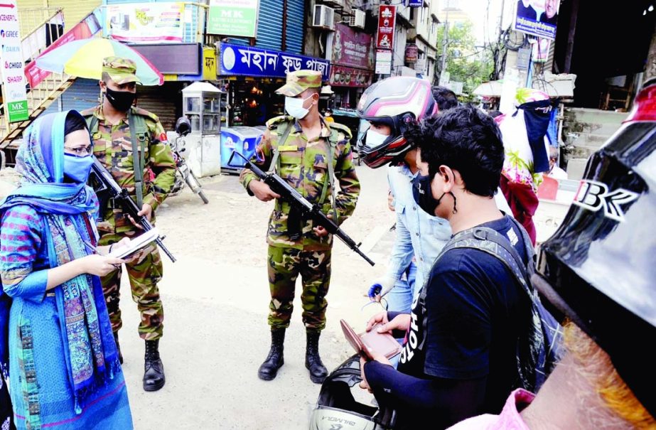 Army personnel conduct mobile court in the city's Dholaipar area on Monday with a view to making lockdown a success.