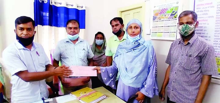 Faridpur Modhukhalin Upazila Rural Development Officer Jahidur Rahman disburses loans amounting Tk. 12 lakh among twelve rural entrepreneurs in a formal ceremony organized by Bangladesh Rural Development Board at Upazila Palli Bhaban on Monday with a slog