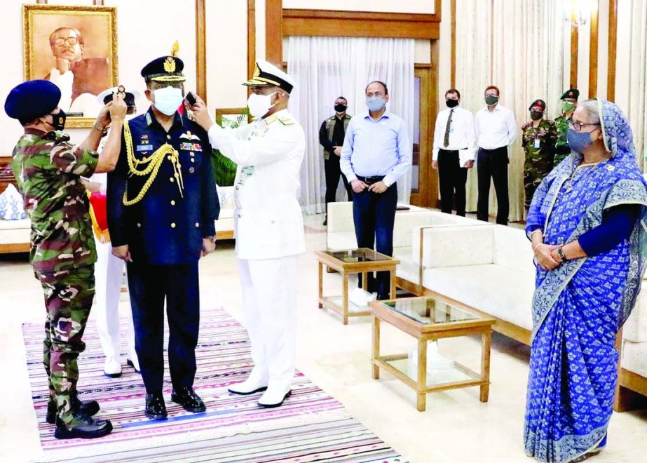 In presence of Prime Minister Sheikh Hasina, Chief of Army Staff General SM Shafiuddin Ahmed and Acting Chief of Naval Staff Rear Admiral M Abu Ashraf adorn the Chief of Air Staff Air Marshal Shaikh Abdul Hannan with the rank badge of Air Chief Marshal at