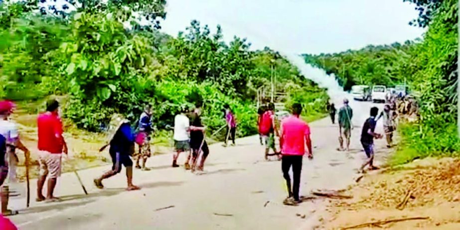 Locals during a clash with police personnel at Assam-Mizoram border at Lailapur in Cachar district, Monday.