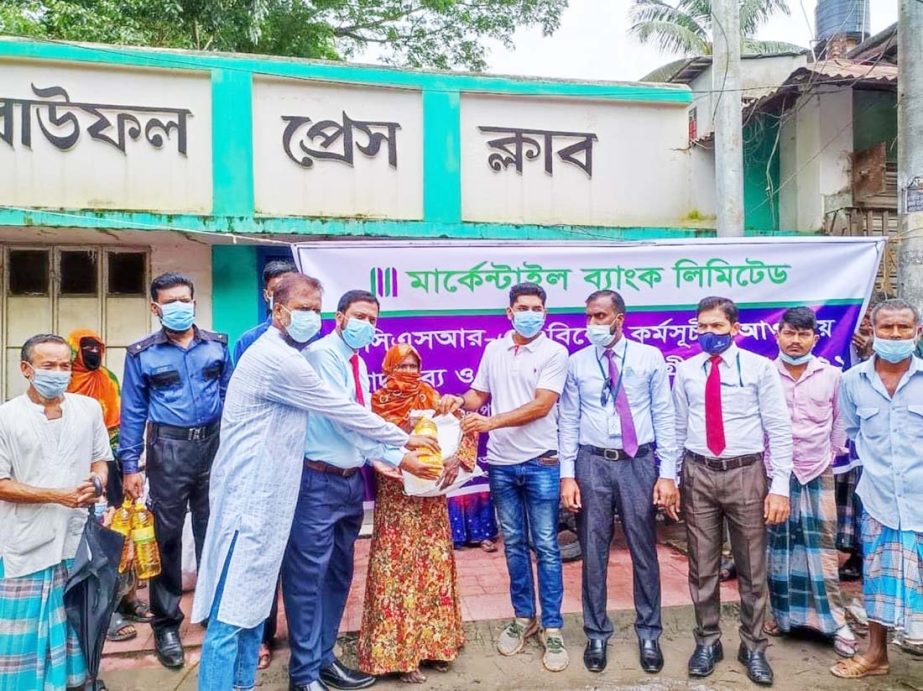 Mercantile Bank Limited (MBL) distributed food and health safety equipments among helpless and destitute people of Baufal in Patuakhali on Wednesday. Al Mamun, Head of MBL Kalaiya Branch and Md. Alamgir Hossain, In-charge of Kalishuri Bazar sub-branch, Ka