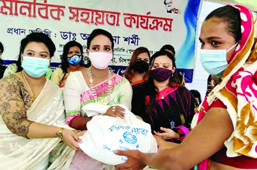 PUNAK President Dr Afsana Sharmi distributes relief packs among the poor workless women at a function held on the premises of Chandpur Sadar Model Thana on Wednesday.