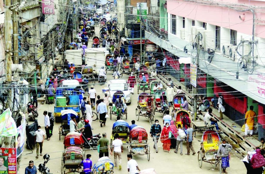 Pedestrians and also passengers moving during lockdown without maintaining health guidelines The snap was taken from the city's Babubazar area on Thursday.