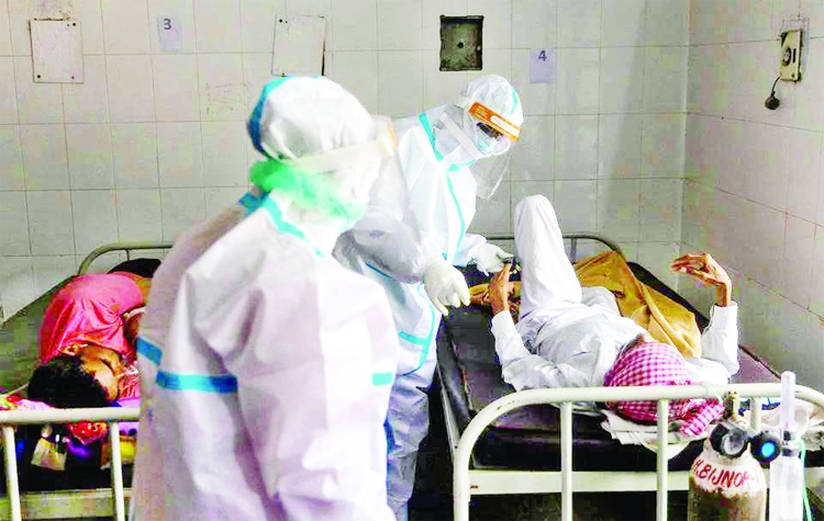 Medics tend to a man with breathing problems inside a Covid-19 ward of a government-run hospital, amidst the coronavirus pandemic, in Bijnor district, Uttar Pradesh, India.