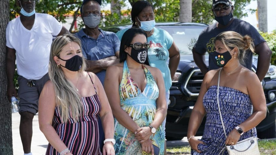 A group waits to get a COVID-19 test, Saturday, July 31, 2021, in North Miami, Fla. Federal health officials say Florida has reported 21,683 new cases of COVID-19, the state's highest one-day total since the start of the pandemic. The state has become th
