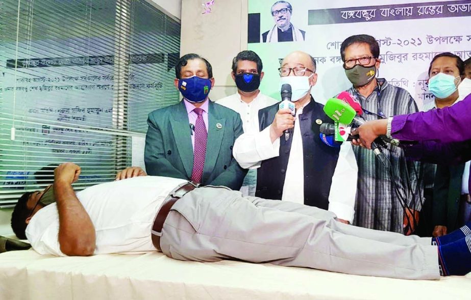 Industries Minister Nurul Majid Humayun speaks as the chief guest at a voluntary blood donation programme in remembrance of the self-sacrifice of Father of the Nation Bangabandhu Sheikh Mujibur Rahman at Ekushey Television Limited office in the capital on