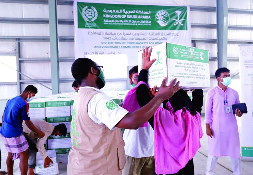 A delegation of the Muslim World League, a strategic partner and implementer of a relief project funded by the King Salman Humanitarian Aid & Relief Centre distributes emergency food baskets among 5,000 people living in the flood affected areas of Satkhir