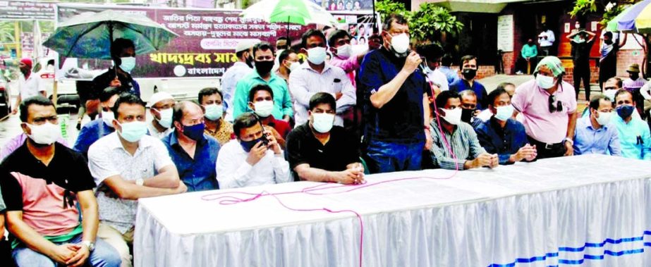 General Secretary of Bangladesh Awami Juba League Mainul Hossain Khan Nikhil speaks at the food distribution among the destitute as month-long rationing system marking mourning month August in front of AL office in the city's Bangabandhu Avenue on Monday