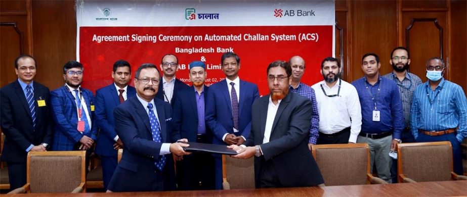 Md. Forkan Hossain, General Manager of Bangladesh Bank (BB) and Sajjad Hussain, President and Managing Director (CC) of AB Bank Limited, exchanging an agreement signing document on Automated Challan System (ACS) at BB head office in the capital recently.