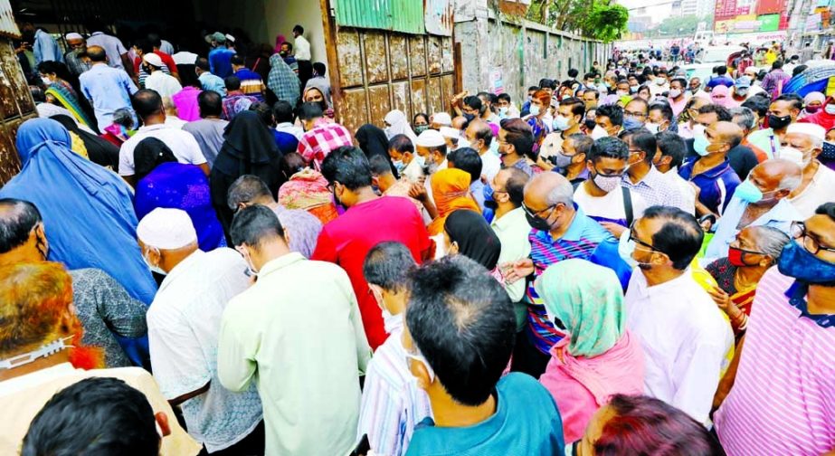 People crowd a vaccination centre in the capital's Mugda area to receive a second dose of the Oxford-AstraZeneca Covid-19 vaccine on Monday.