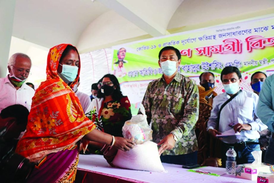 Minister for Chittagong Hill Tracts affairs Bir Bahadur Ushwe Sing, MP distributes relief among 2000 families affected by the recent flood in Lama upazila of Bandarban district in a ceremony organized by district administration and Zila Parishad at Lama B