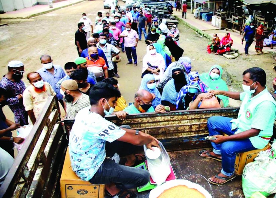 Commoners in a long queue to buy essentials from TCB truck. The snap was taken from in front of the Secretariat on Tuesday.