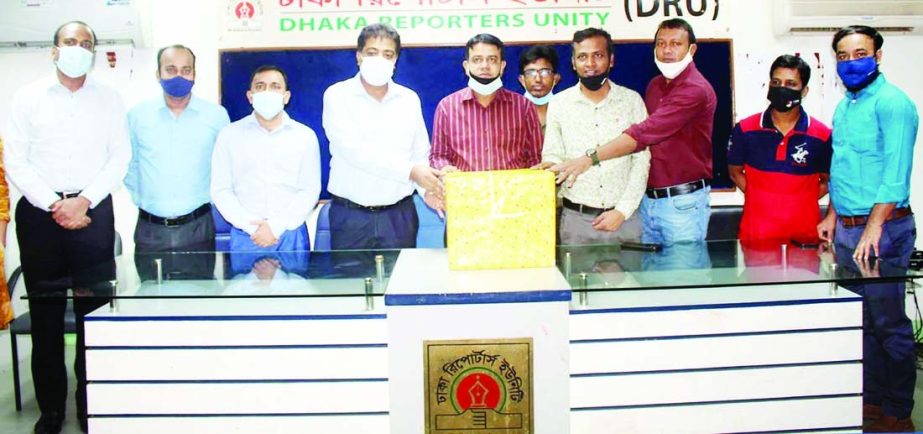 Marketing Director at PRAN-RFL Group Kamruzzaman Kamal hands over protective equipment at DRU office on Wednesday. DRU President Morsalin Nomani and its General Secretary Moshiur Rahman Khan, among others, received the equipment.