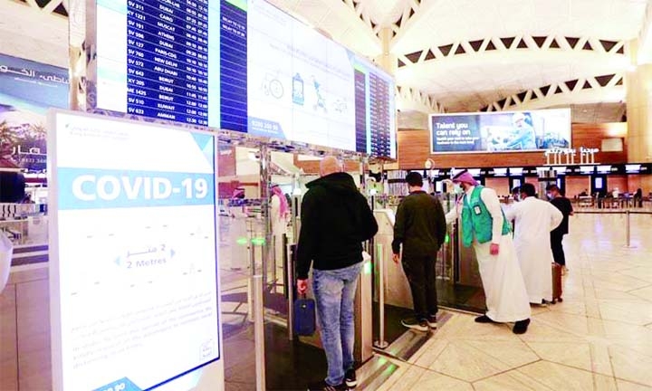 Saudi nationals scan their documents at a digital-Immigration gate at the King Khalid International Airport.