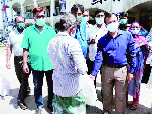 Brahmanbaria Bijoynagar Upazila Nirbahi Officer KM Yasir Arafat distributes food aid provided by the Prime Minister Sheikh Hasina among 40 families of the locality who applied calling 333 for help in a formal ceremony on Thursday.